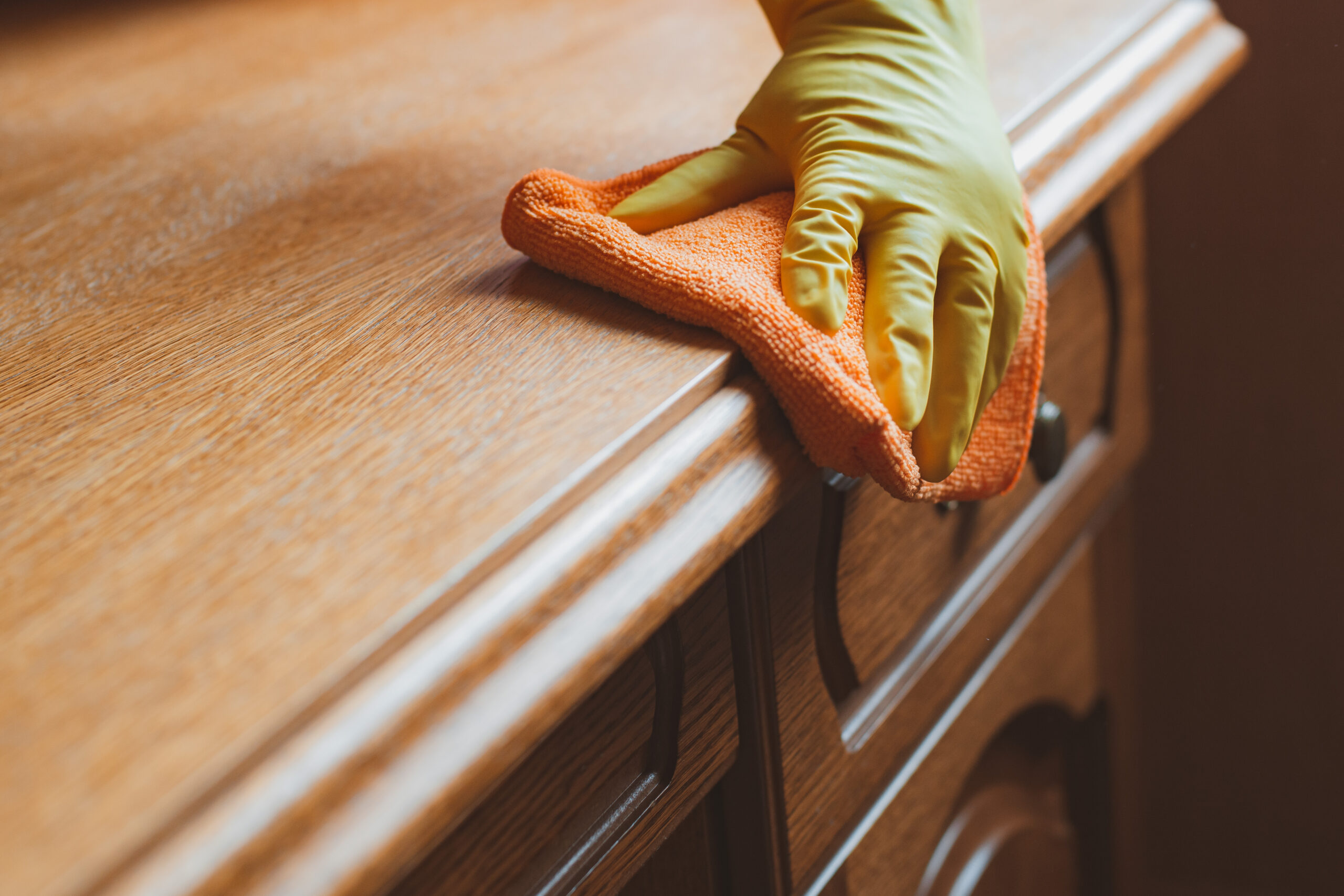 dusting wooden furniture