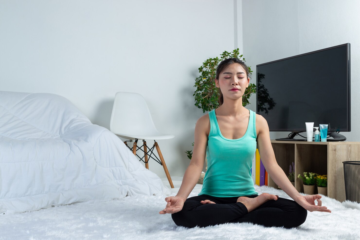 young girl doing yoga to release stress